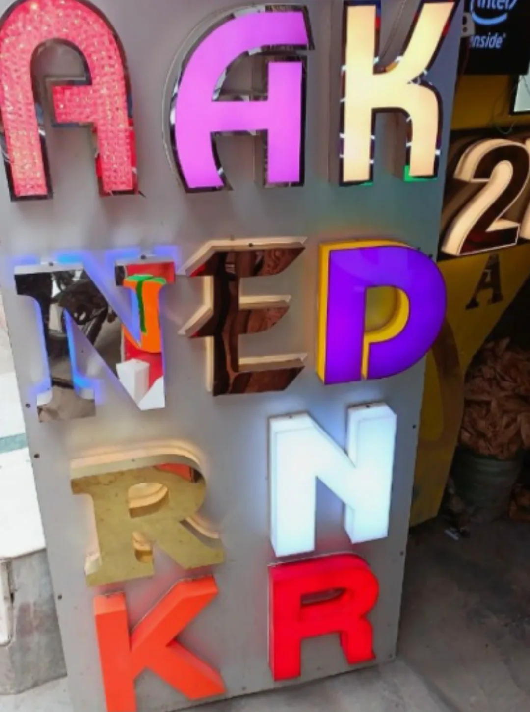 Channel letter samples on a board in different colours, faces and lighting styles