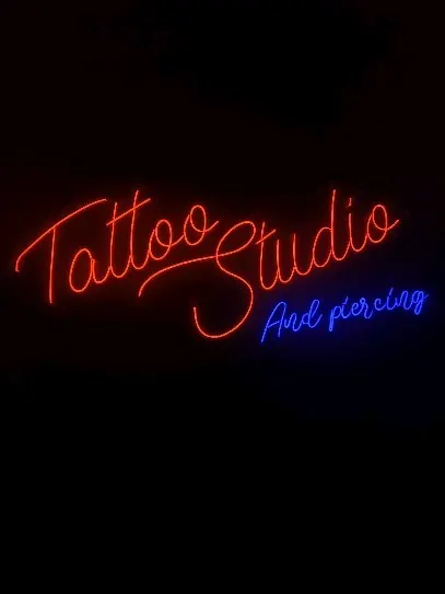 Red 'Tattoo Studio' script neon with blue subtitle